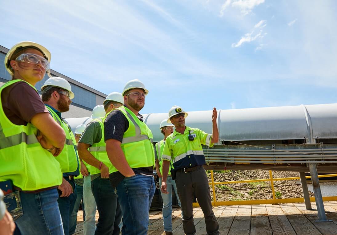 Group of people wearing hard hats