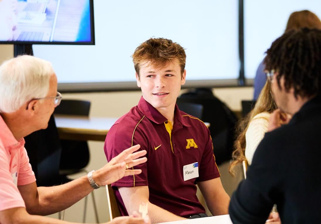Two people talking in classroom