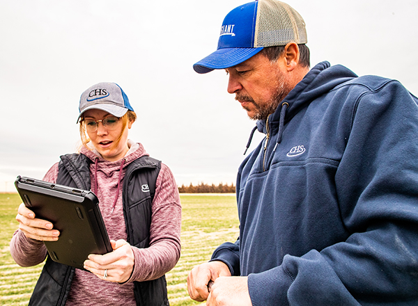 Man and woman looking at clipboard