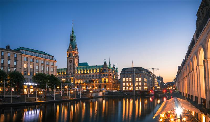 City canal at dusk with historic building and lights