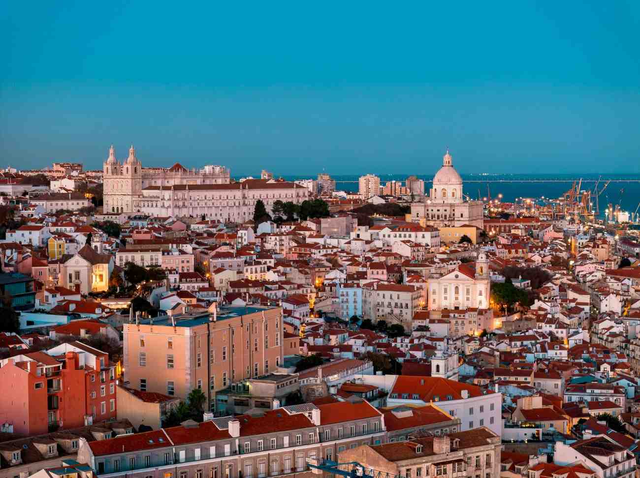 City view with historic buildings and sea in background