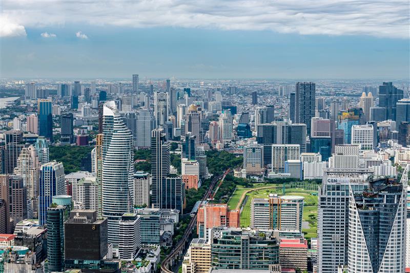 Aerial view of a modern city skyline with tall buildings.