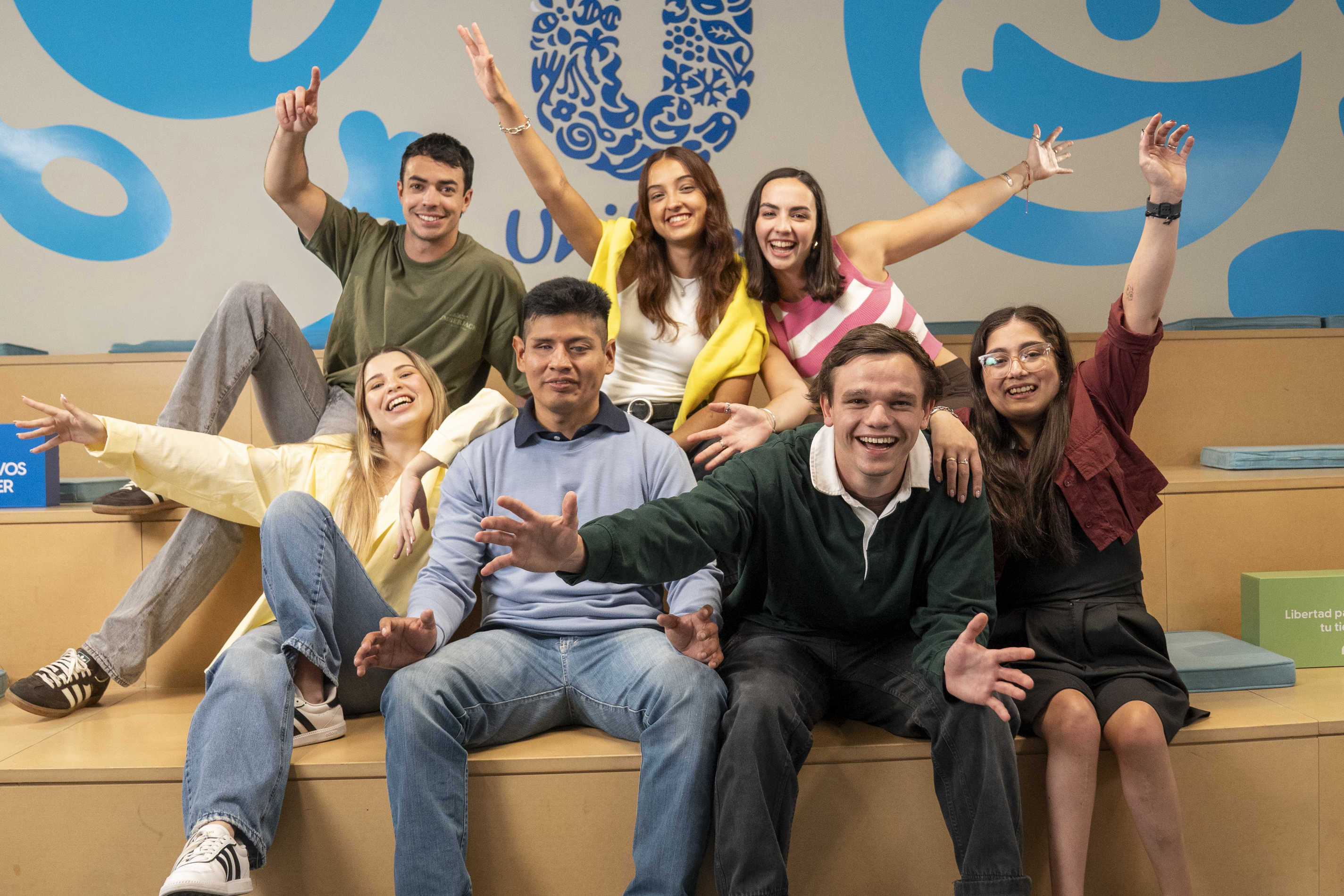 Smiling group of young adults posing indoors