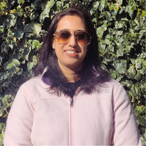 Jumana, Head of Procurement, Unilever Beauty & Wellbeing, smiling at the camera in sunglasses