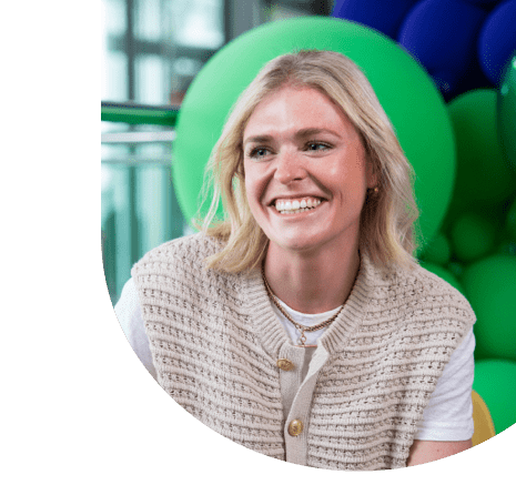 Smiling employee in a large modern office