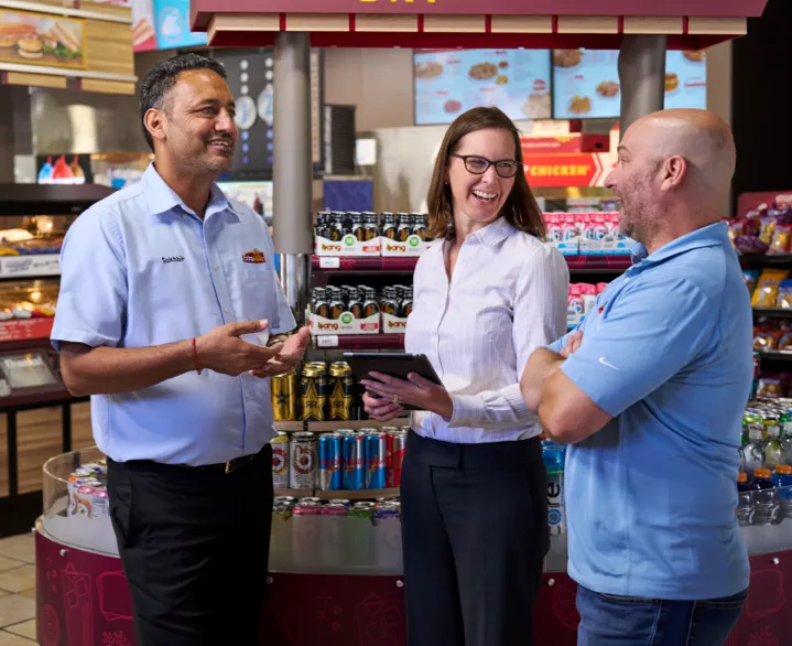 three employees in a dicussion