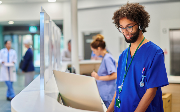 Image of nurse at work station