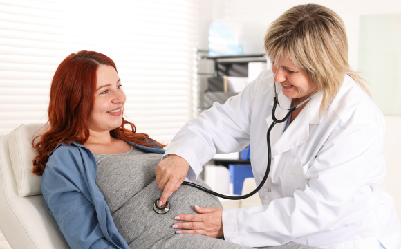Pregnant woman and doctor