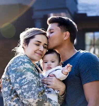 Soldier holding her child and significant other