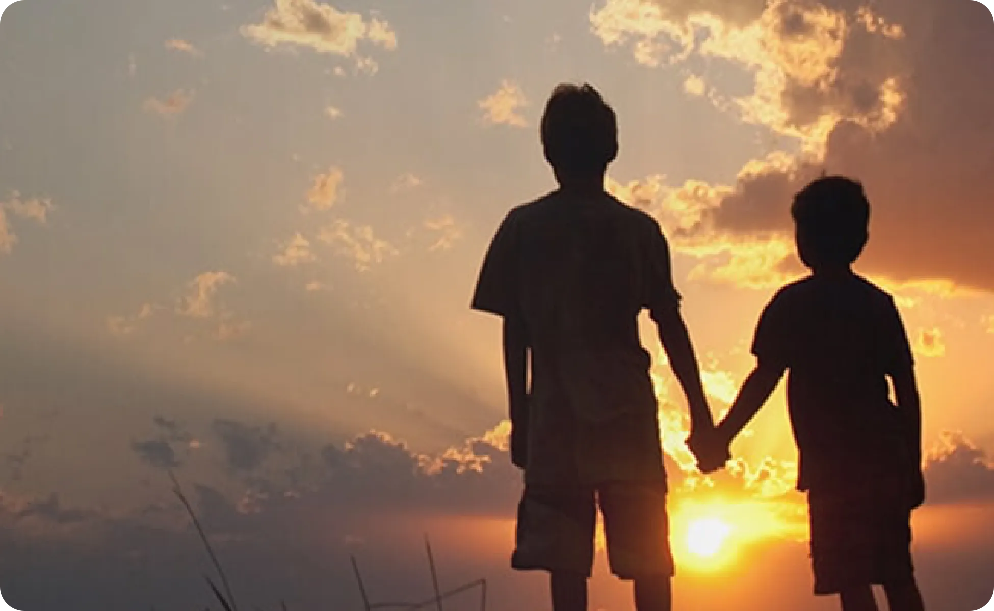 Two people enjoying a sunset