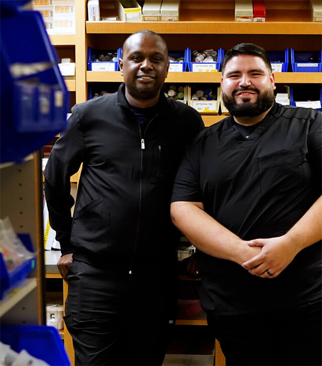 Two people smiling for the camera