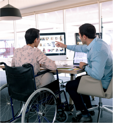 Patient and a technician looking at a computer.