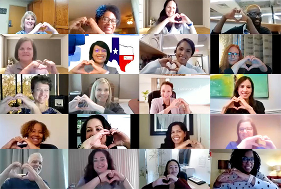 Pic: A group of 20 people smiling and making a heart symbol with their hands on a video chat program