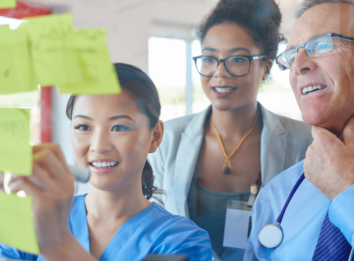 Physician looking at writting board