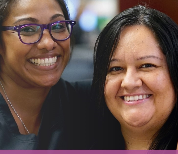 Two people smiling for the camera