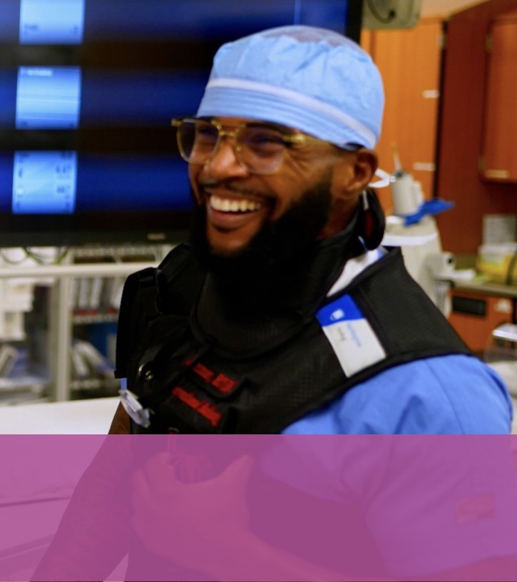 People wearing scrubs, smiling for the camera