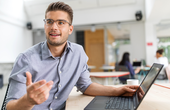 Group of men and women standing together and smiling