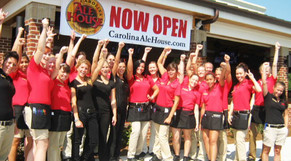 Employees standing outside for grand opening