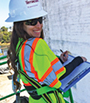 woman writing on a clipboard