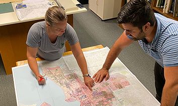 Two people looking at a map