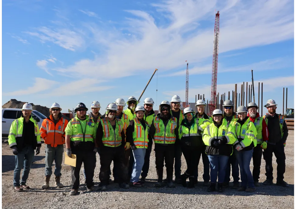 employees giving group pose