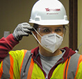 Employee putting mask on