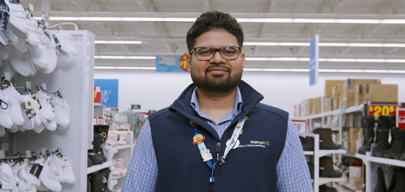 Male employee standing in a Walmart department store