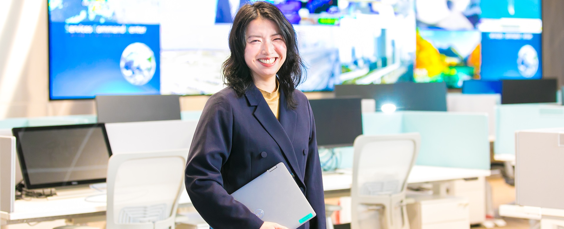 woman holding laptop