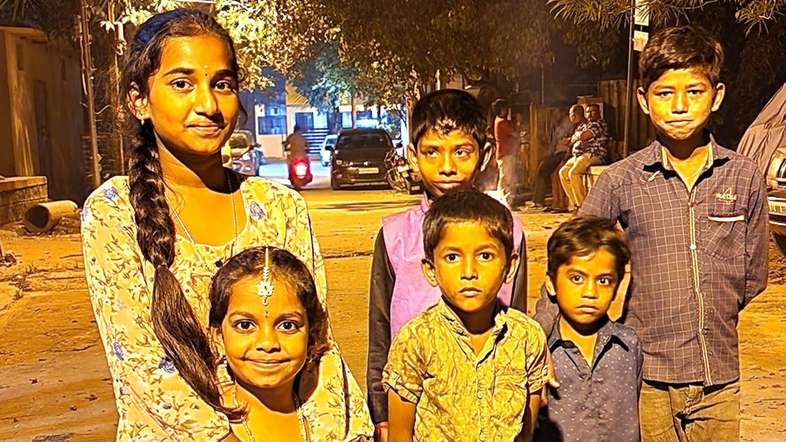 Children smiling in their traditional attire