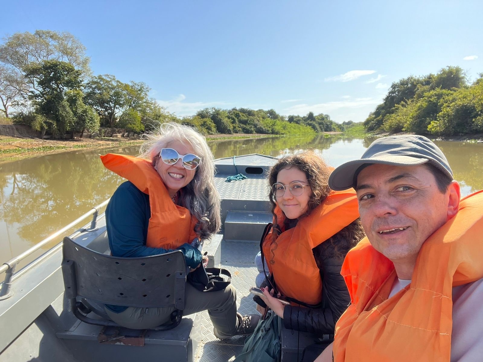 Ana with her family on a small boat