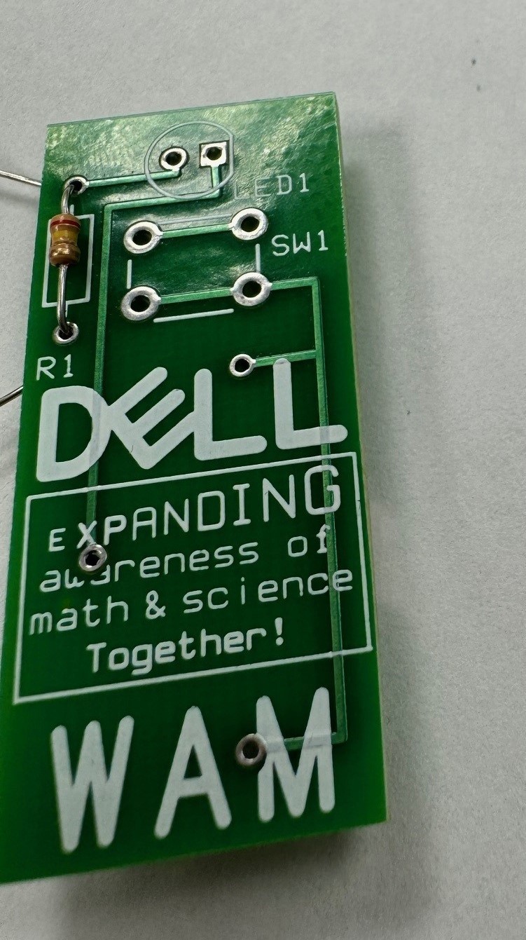 Image of a device that says, "Dell: Expanding awareness of math & science together!"