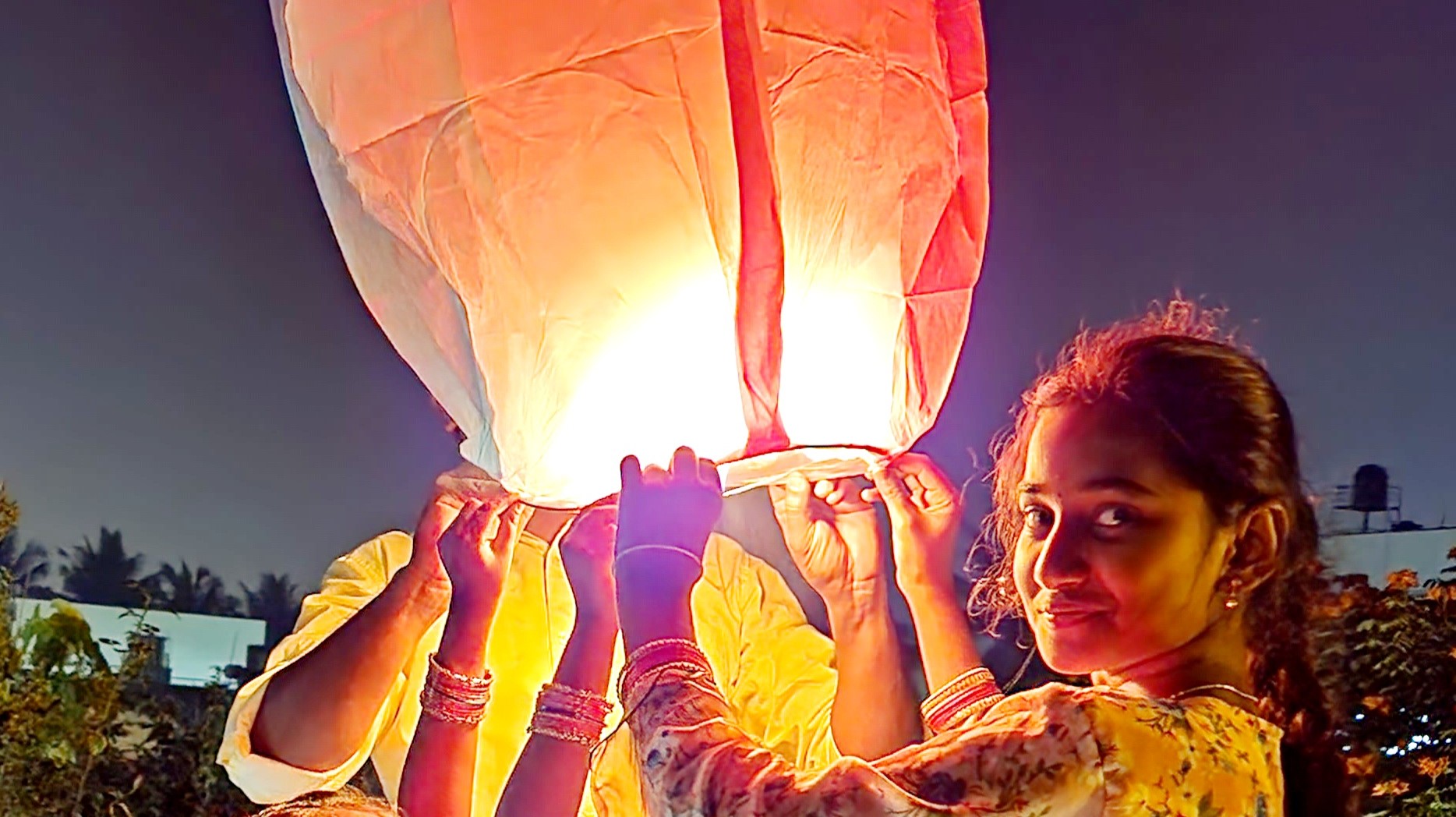 Children holding up a skylantern