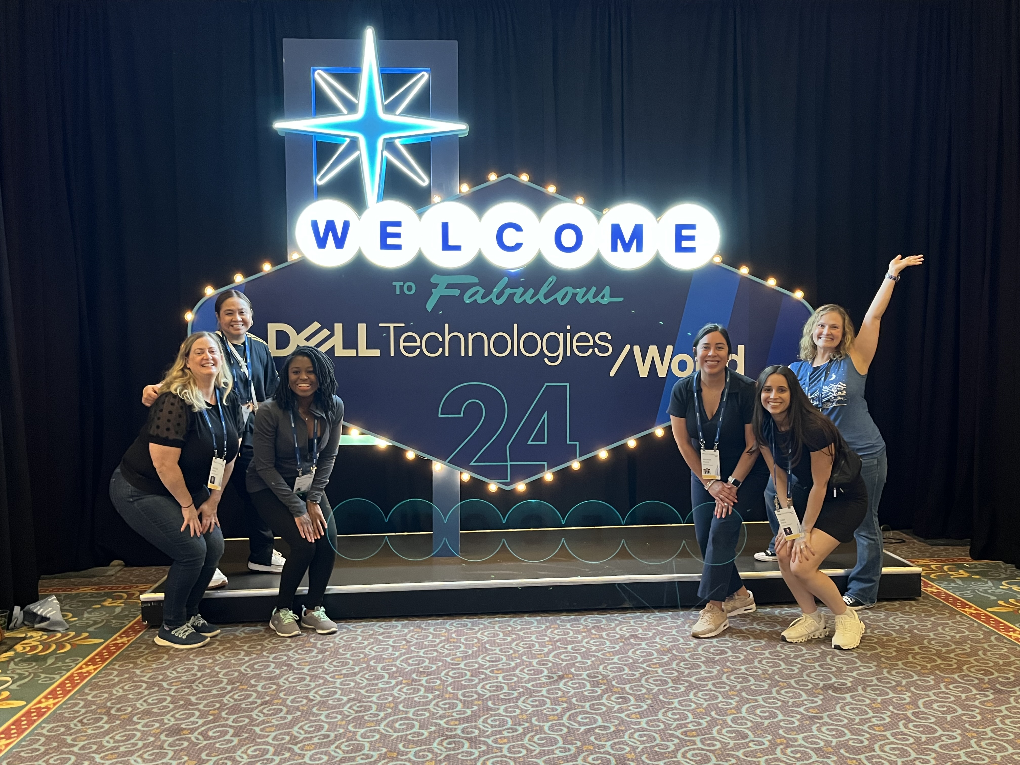 Saba poses in front of a Dell Technologies World sign.