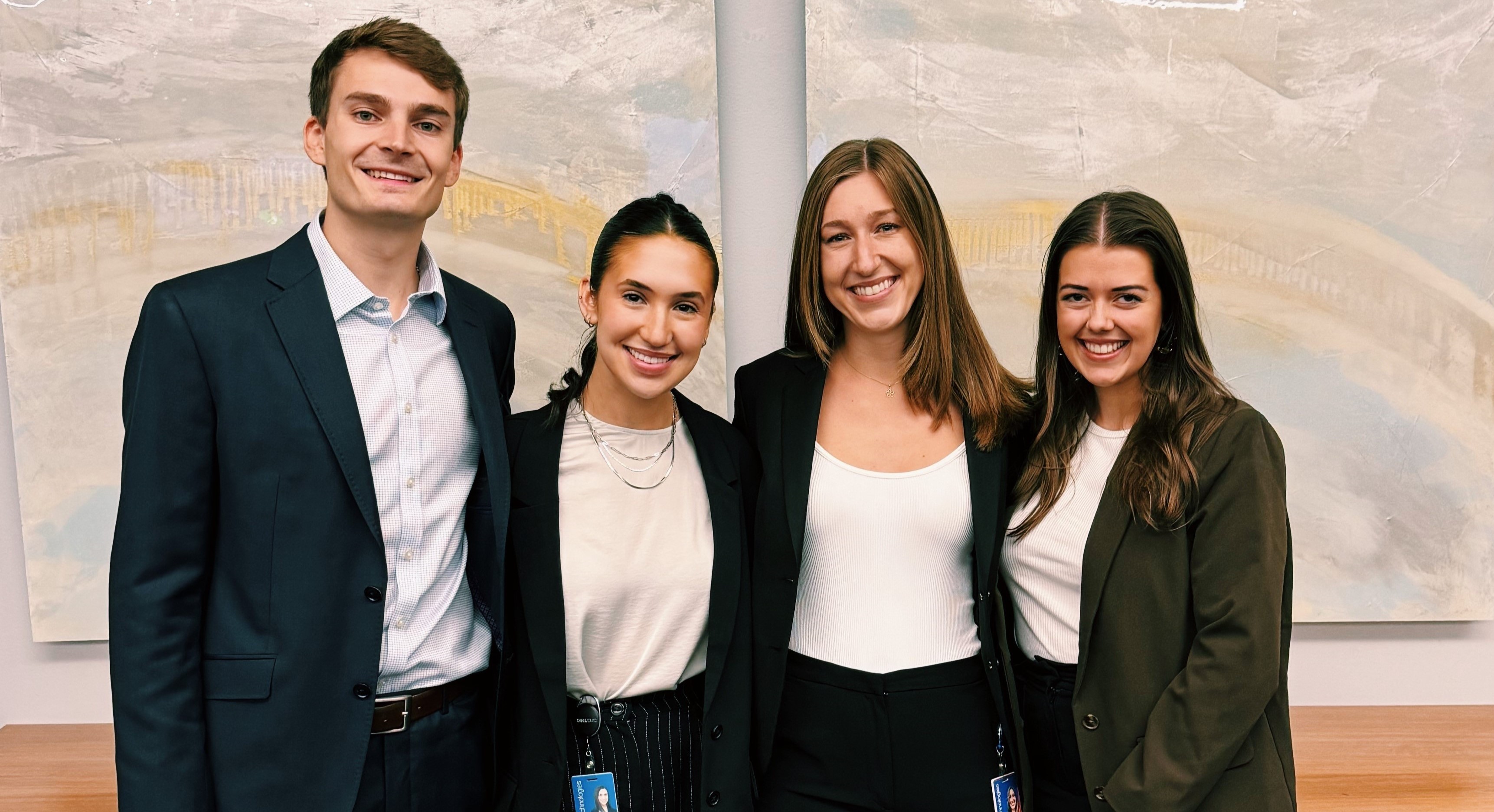 Emily standing with her SCDP project team