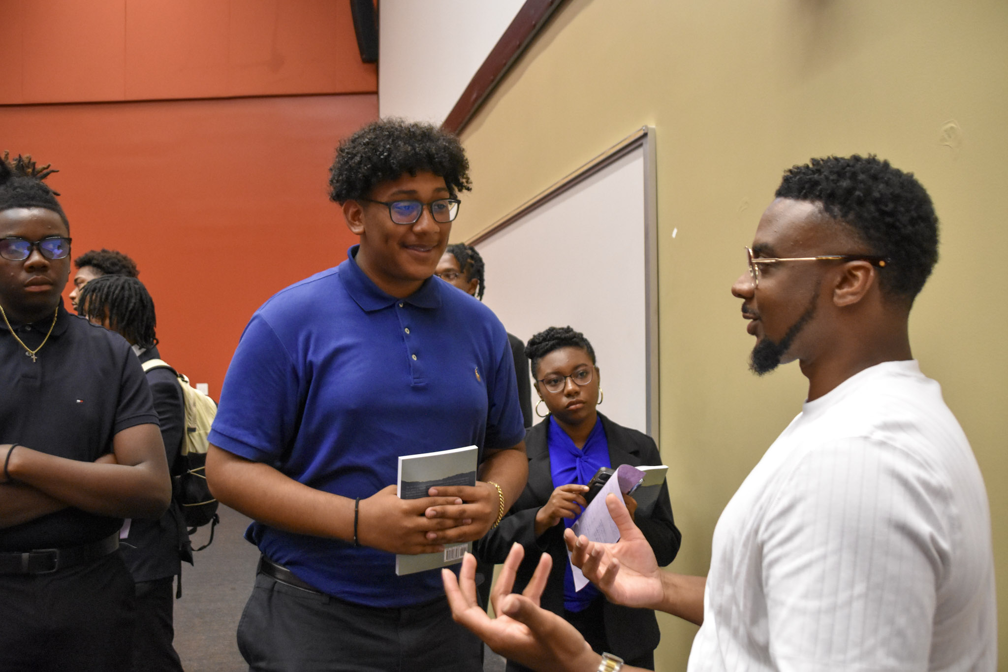 Kevin working with a group of students