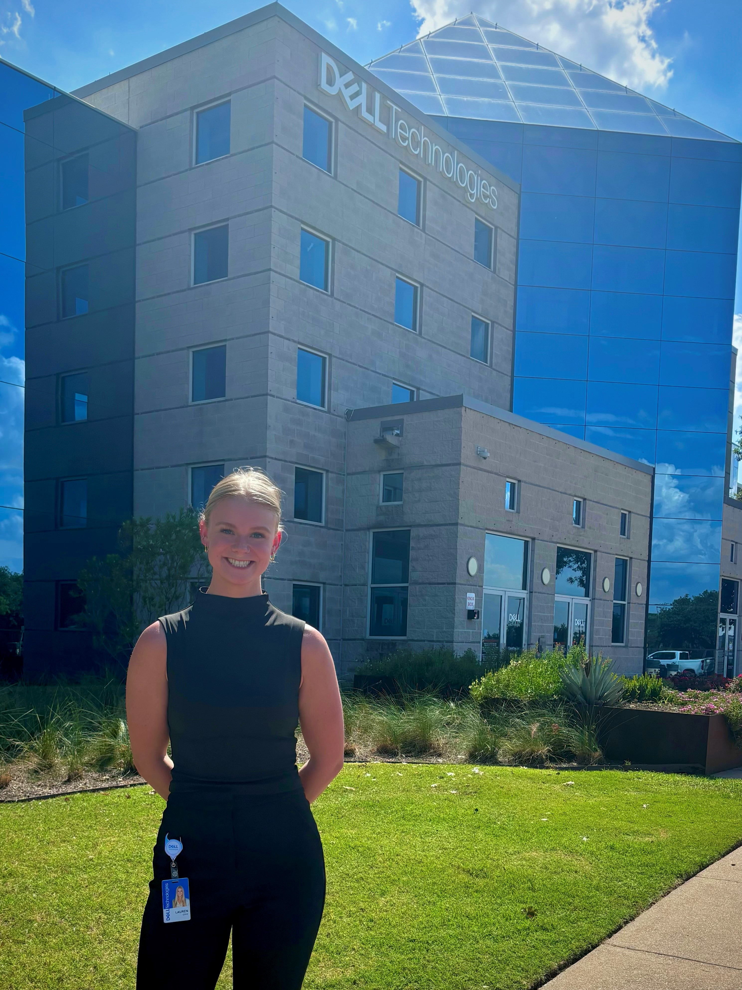 Lauren poses in front of a Dell building.