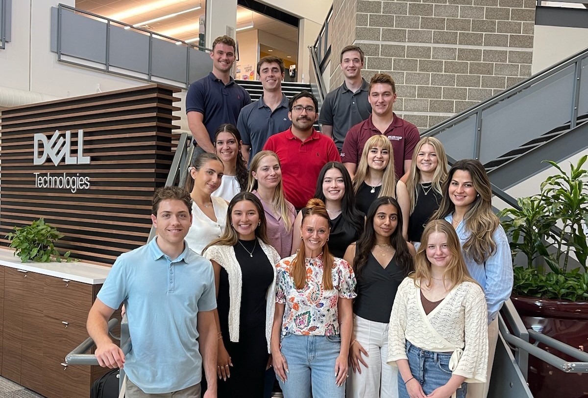 Mica with interns in the lobby of Round Rock 1