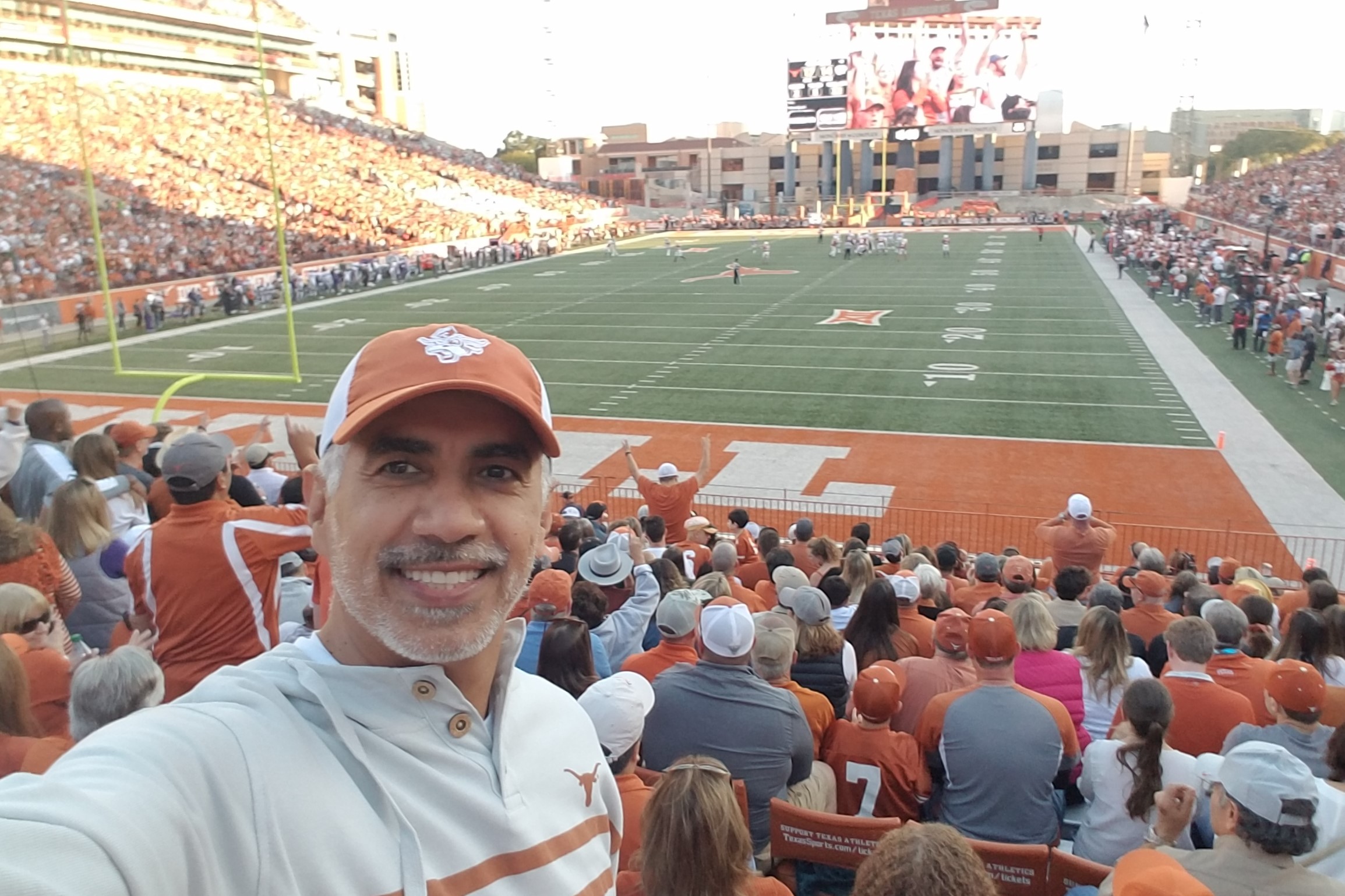 Ociel takes a selfie at a University of Texas football game.