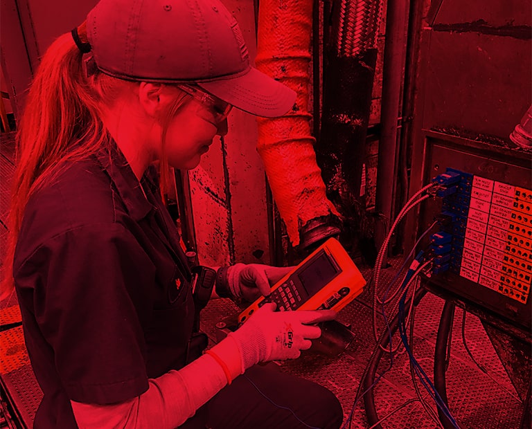 Lady operating on a digital meter