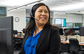 Professional wearing a headset in an office workspace.