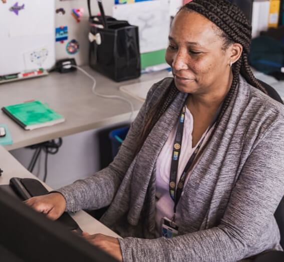 Woman typing at a desk