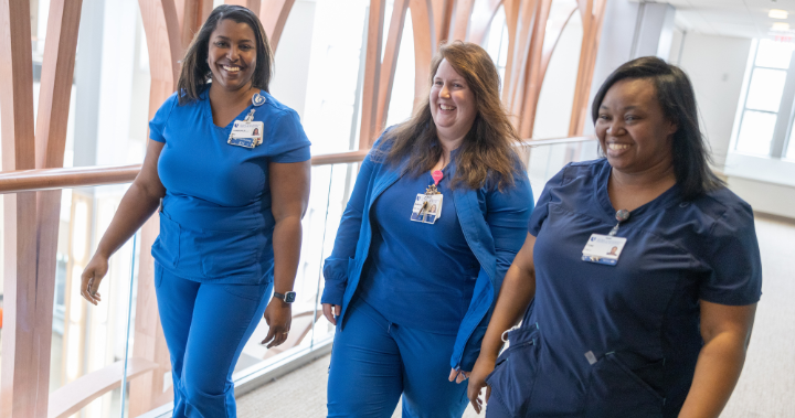 image of nursing team members walking down a hallway