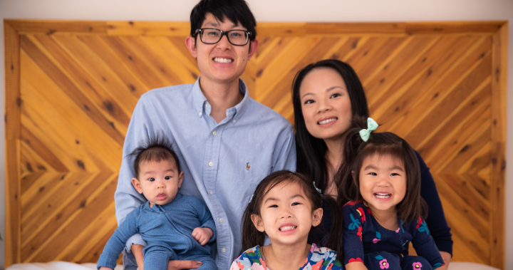 Tam and Andrew smile with their three children.