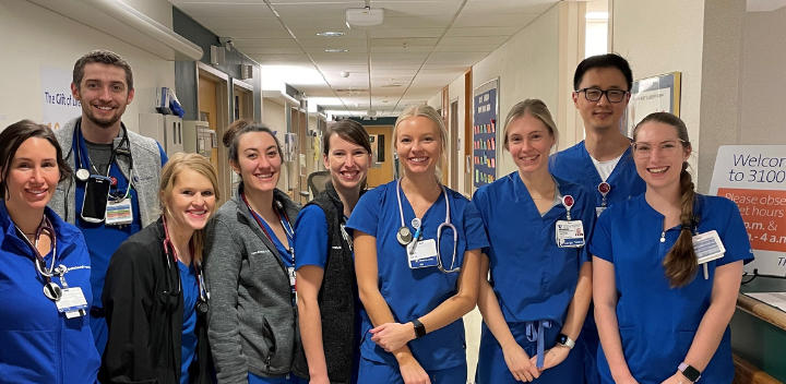 nursing team members standing side by side and smiling