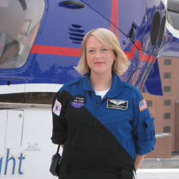 Kelly in front of a life flight helicopter.