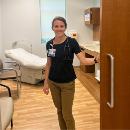 Liza smiles from a clinic room at Duke Health.