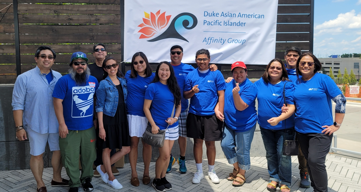 Diverse group of employees posing for a picture