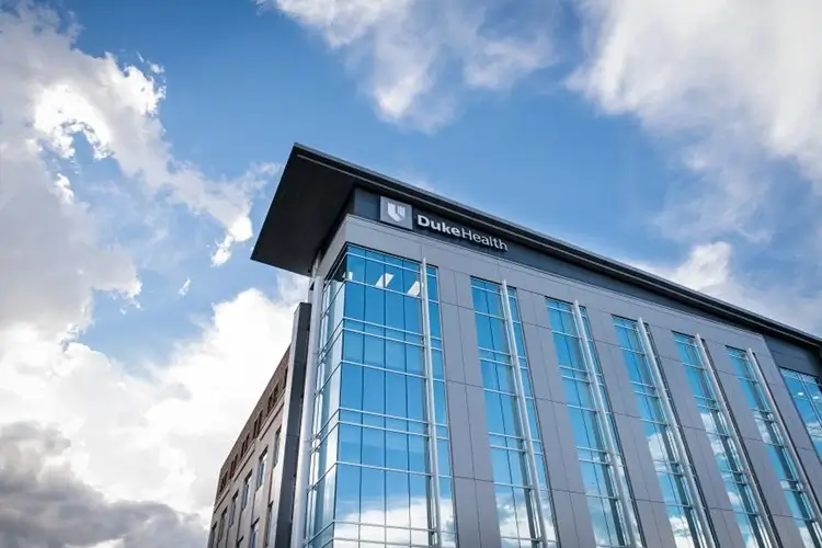 large modern office building with Duke Health logo at the top