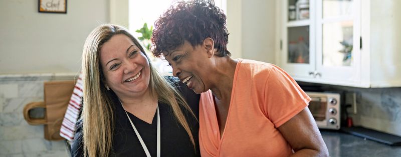 nurse and patient laughing