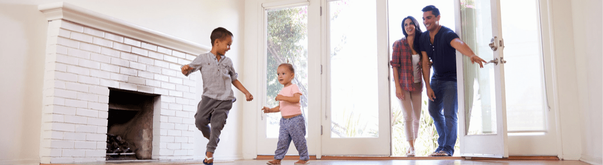 Family entering their home